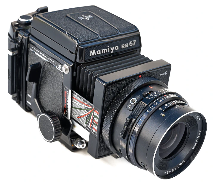 A photo of the Mamoya RB67 camera showing the focusing knob and the shutter cocking lever.
