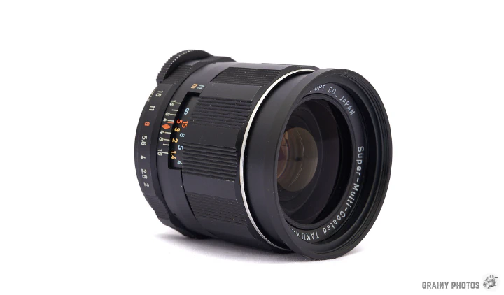 A photo of the Super-Takumar 35mm f2 lens on its side.