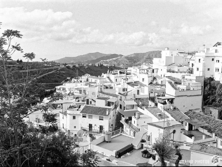 A black-and-white film photo of Competa