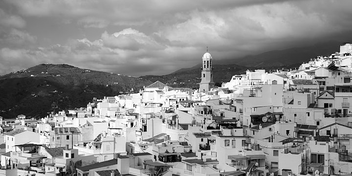 A black-and-white film photo of the town of Competa