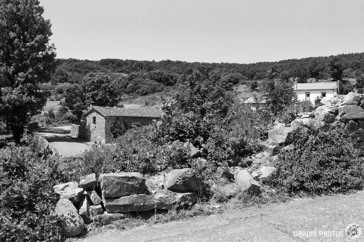 A black-and-white photo of stone houses in Estalaya