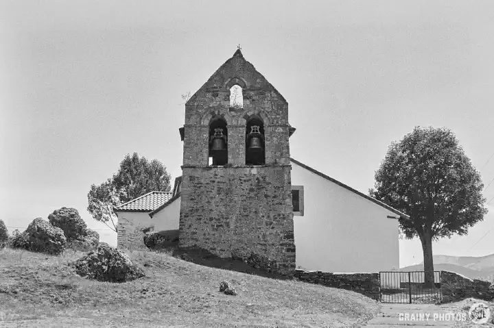 A black-and-white film photo of Iglesia de San Cristóbal, Santibáñez de Resoba