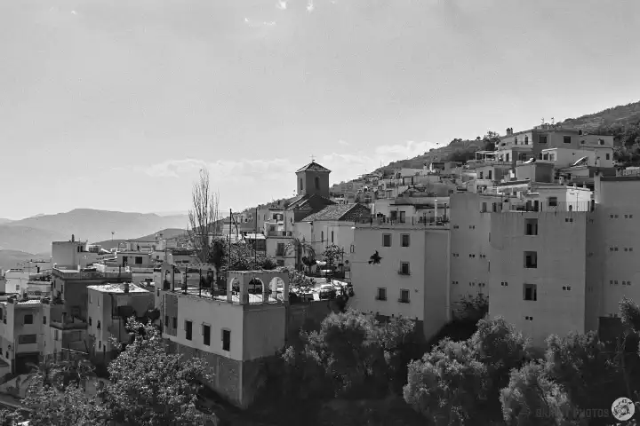 A black-and-white photo of Soportújar on the hillside. 